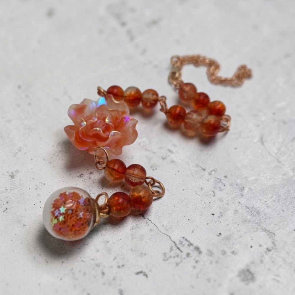Handmade orange floral car charm.